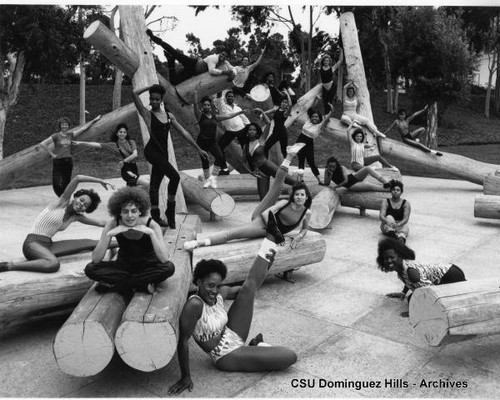 Dancers pose on sculpture