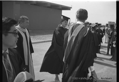 Graduates gather before processional