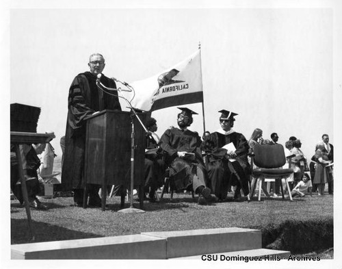 Dr. Laser speaking at commencement