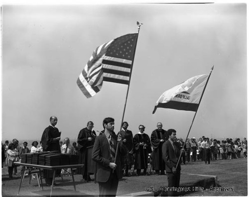 Commencement speakers during national anthem