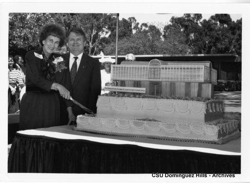 Cutting cake at Loker Union groundbreaking