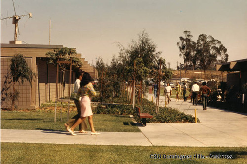 Students walking around Small College