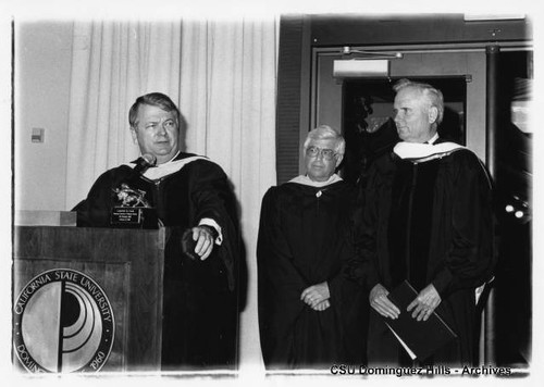 President Detweiler presenting honorary doctorate to Lodwrick Cook