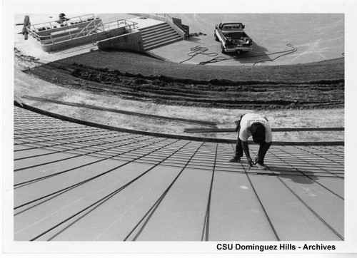 Worker on Velodrome track