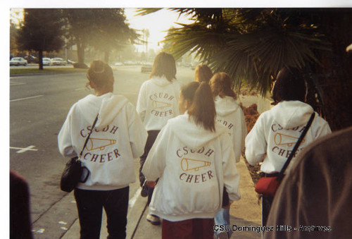 Cheerleaders on sidewalk