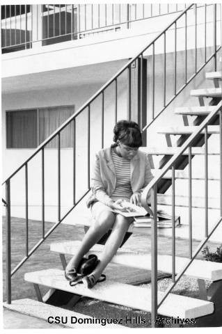 Student on Watt Campus staircase