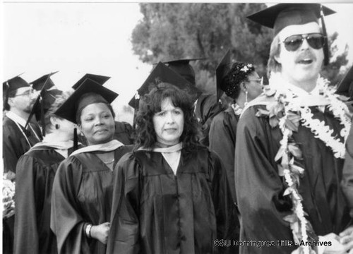 Graduates lining up for diplomas