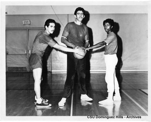 Three Toro Basketball players