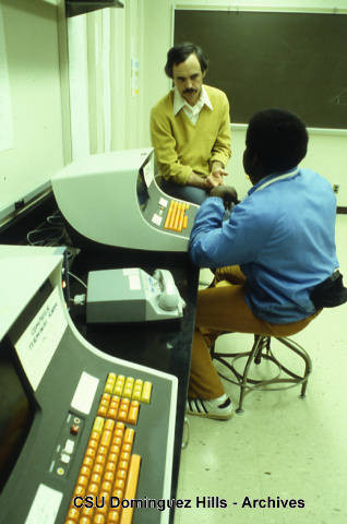 Computer instructor with student