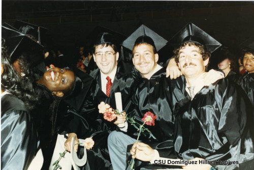 Graduates celebrating after ceremonies