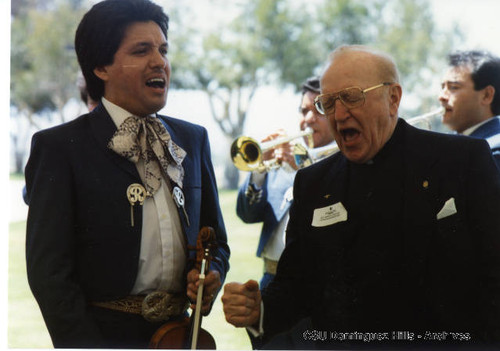 Father Pat McPolin and singer at Loker Union groundbreaking