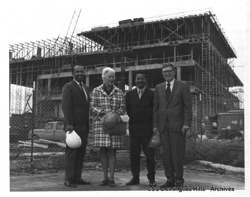 Administrators and visitors at library construction site