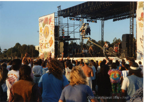 Cameraman on boom at rock concert