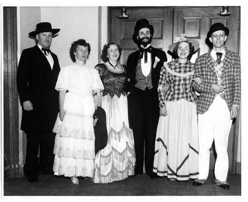 1950 Group of men and women in period costume