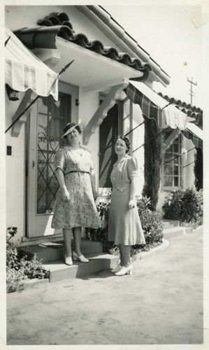 1940, Two Library Staff Pose in Front of a Bungalow