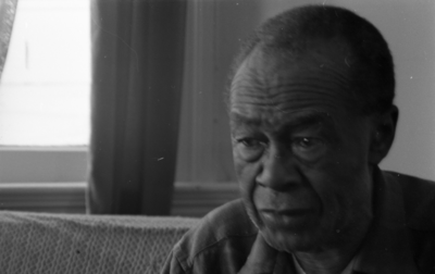 Blues musician Jesse Fuller in his home