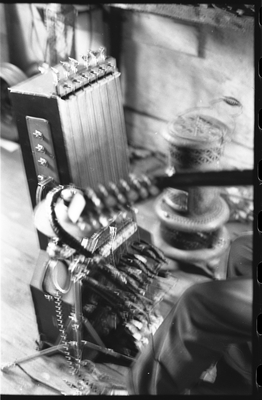 Blues musician Jesse Fuller preparing to play the fodella in his basement