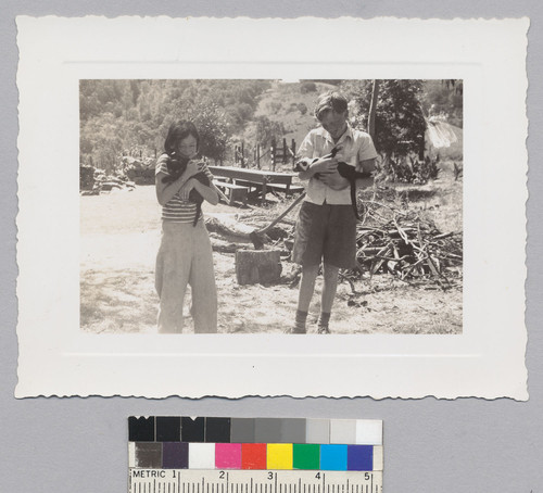 Ursula and Karl Kroeber holding cats Figaro and Nero