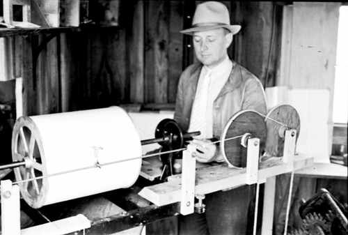 Eugene Cecil LaFond standing by his wave recorder installed near the end of the Scripps pier