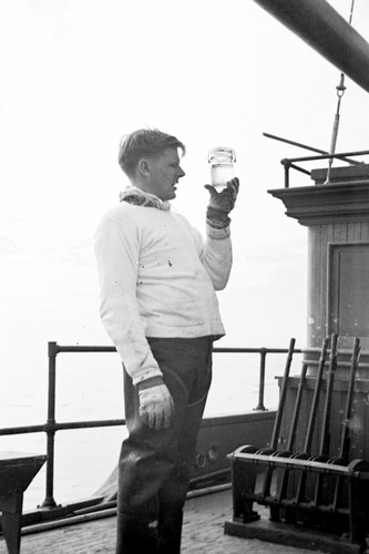 Richard Howell Fleming sampling seawater aboard R/V Scripps