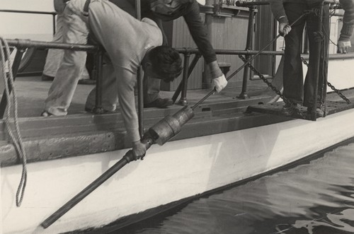 Hiomi Nakamura lifts a piston corer aboard R/V Scripps