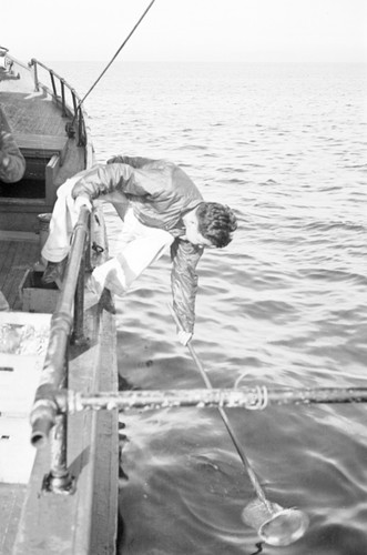 Hiomi Nakamura with dip net aboard R/V Scripps