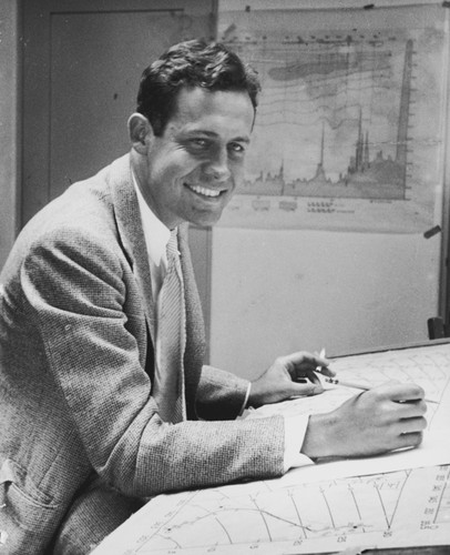 Roger Revelle working at a drafting table