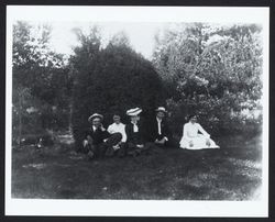 Unidentified group sitting on the grass