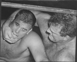 Ben Sharpe and Leo Nomilini wrestling, Petaluma, California, about 1958