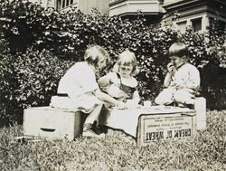 Wilfred Everett Bixby, Jr. having a tea party with unidentified children at the Bixby house, 415 Perkins Street, Oakland, California, about 1912