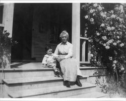 Julia Mock Neil with her grandson, Lincoln Neil Medley at the steps of their home at 231 Wilson Street, Petaluma, California, about 1920