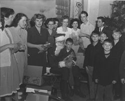 Santa Claus and various St. Vincent's students handing out holiday gifts, Petaluma, California, about 1946