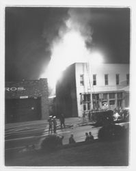 Petaluma Fire Department firefighters at a commercial building in downtown Petaluma, California, 1950s