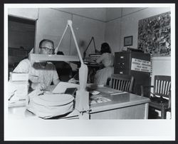 Harry Loucks at his desk in the Sonoma County Office of Education