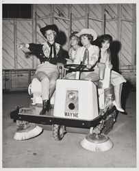 Girls ride motorized sweeper at the Sonoma County Fair, Santa Rosa, California