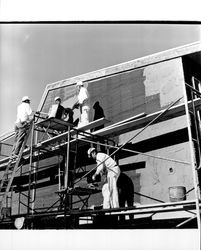 Applying Calaveras Plastic to exterior of the Santa Rosa Garden Apartments