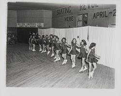 Line of skaters linking arms in the Skating Revue of 1957, Santa Rosa, California, April, 1957