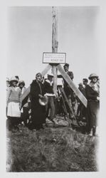 Sign being erected on flag pole raised by Captain Smith in 1846