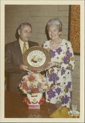 Helen Putnam presenting a plaque to R. Benton, fire chief, Petaluma, California, 1972