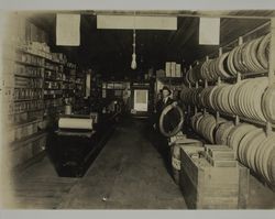 Henry Jenkins in his automobile accessories store, 208 Davis Street, Santa Rosa, California, between 1910 and 1920