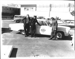 Inspecting a new police car, Petaluma, California, 1956