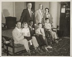 Sport figures with crippled children who participated in the charitable events of the Red Coat Organization, Santa Rosa, California, 1960