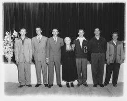 Older woman with six young men, Petaluma, California, about 1951