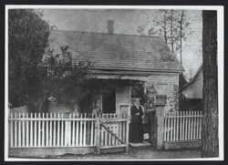 Portrait of Mary Ann Marshall Ames and her brother John Marshall in front of a house