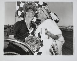 Jayne Mansfield at the car races with car drivers, Santa Rosa, California, 1960