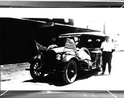 Car with American flags in Geyserville, California, 1925