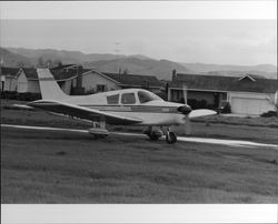 Planes on the ground and in the air at Sky Ranch, Petaluma, California, 1978