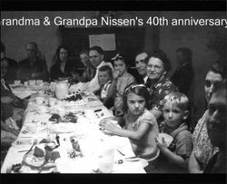 Nissen family gathered at the dinner table for Jacob and Susana Nissens' 40th anniversary in Petaluma, California, 1939