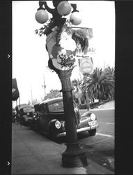 Santa Claus decoration on a light pole, Petaluma, California, about 1935