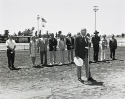 Members of the board and others standing on the race track at the Sonoma County Fairgrounds, about 1974